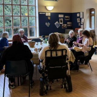 Friendship Makers round a table